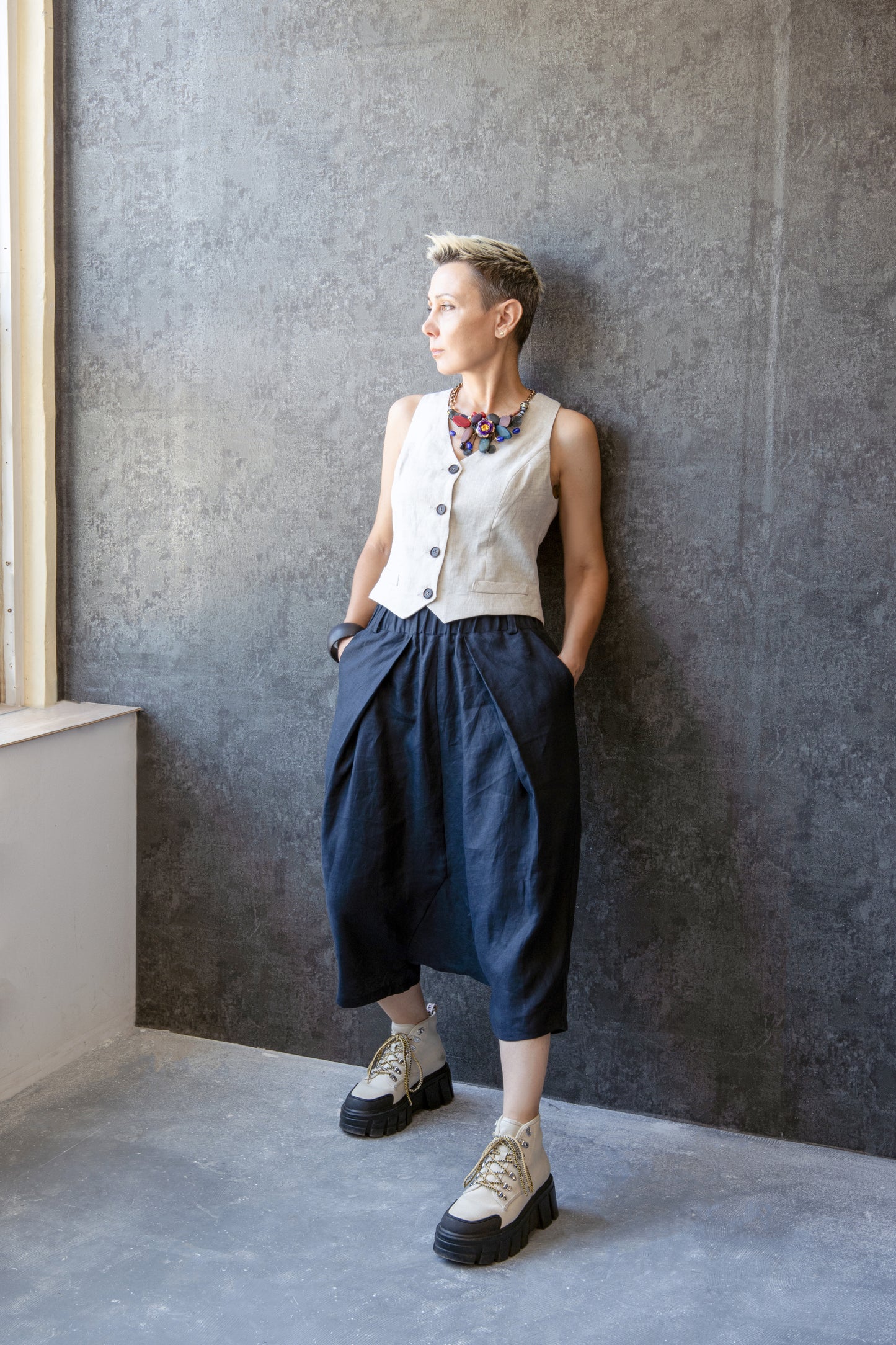 Asymmetric Drop Crotch Linen Pants with Pleats and Decorative Back Flaps – Cropped Unisex Trousers by Jana Coshe