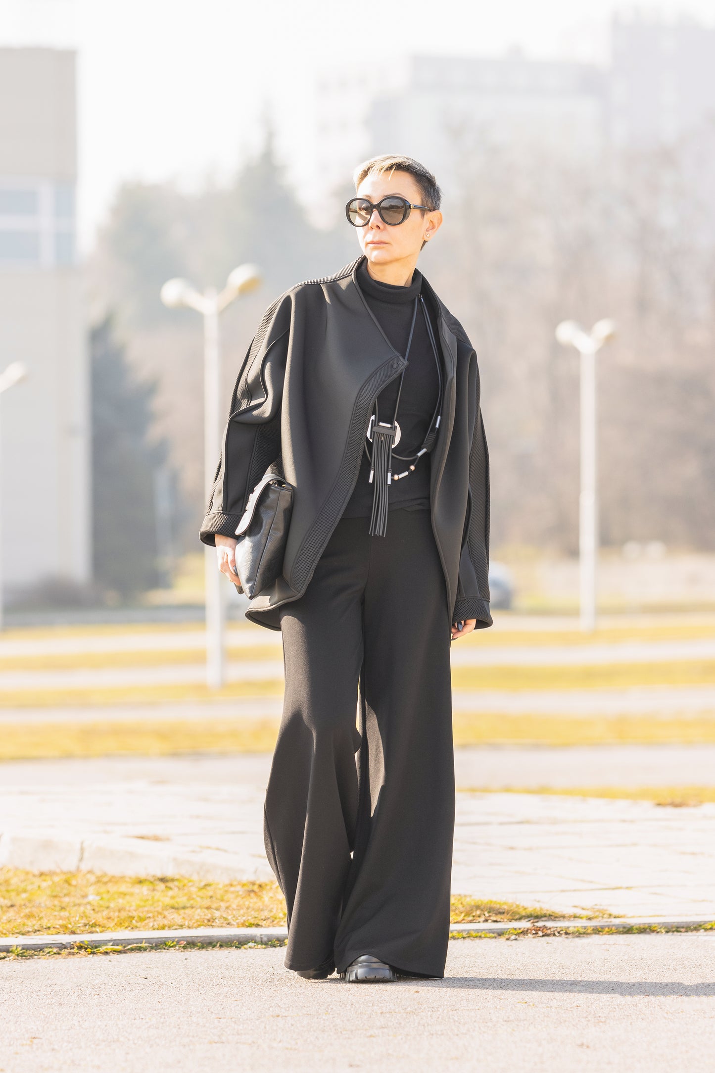 Black Short Neoprene Coat with Asymmetric Silhouette and Button Closure