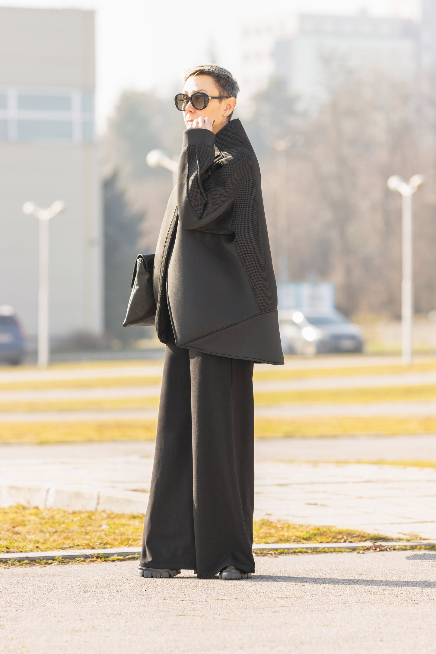 Black Short Neoprene Coat with Asymmetric Silhouette and Button Closure