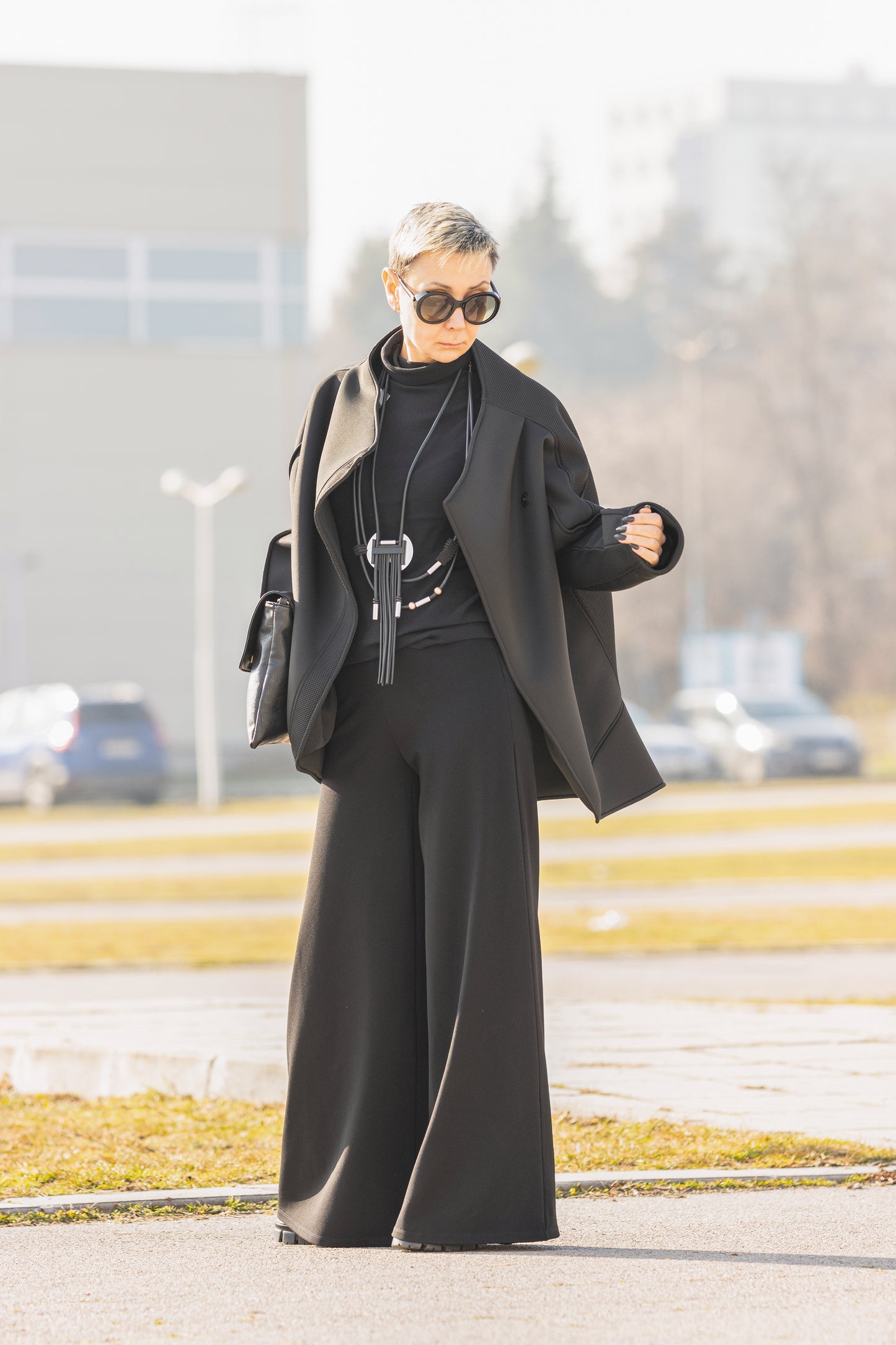 Black Short Neoprene Coat with Asymmetric Silhouette and Button Closure