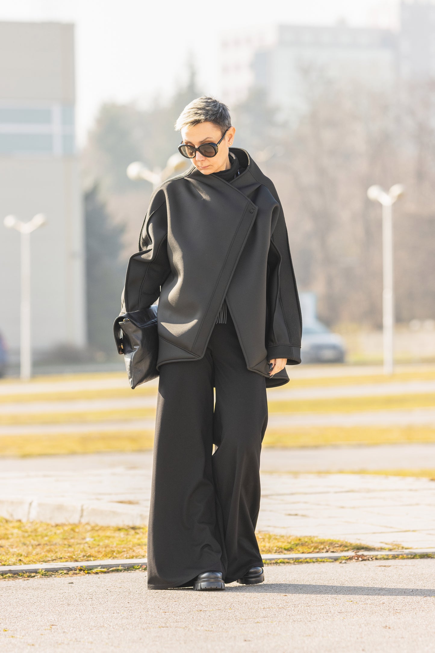 Black Short Neoprene Coat with Asymmetric Silhouette and Button Closure