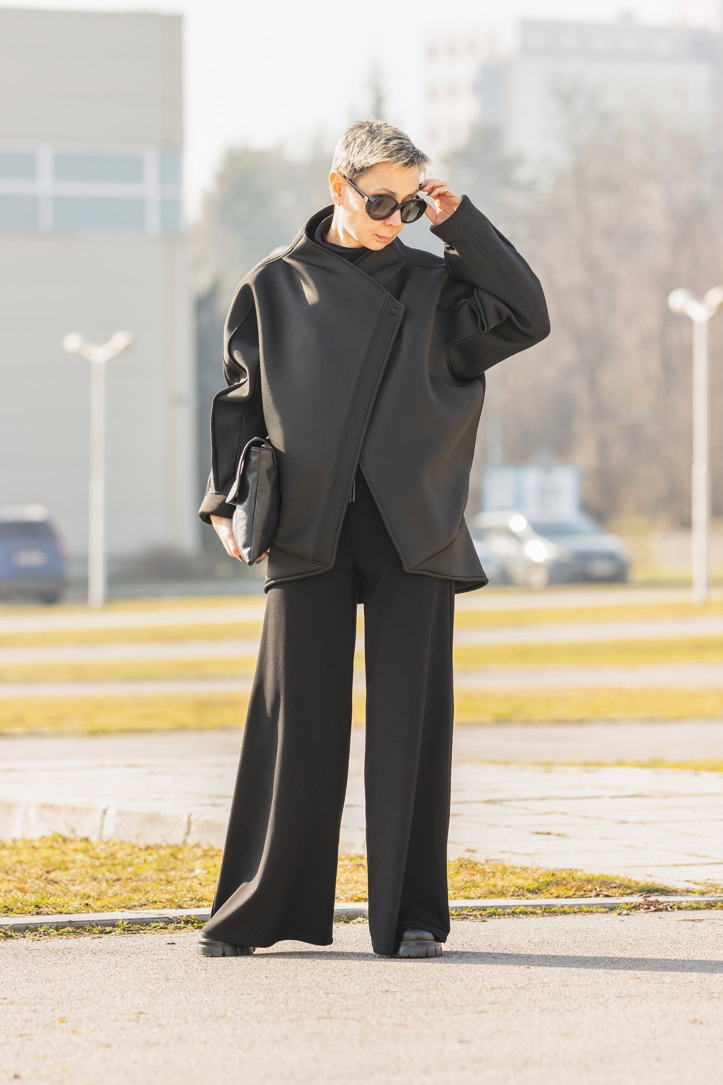 Black Short Neoprene Coat with Asymmetric Silhouette and Button Closure