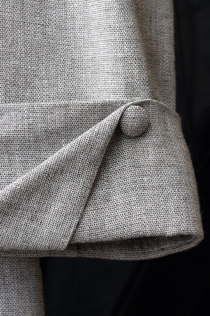 Close-up of cuff with linen button – detail shot of folded sleeve