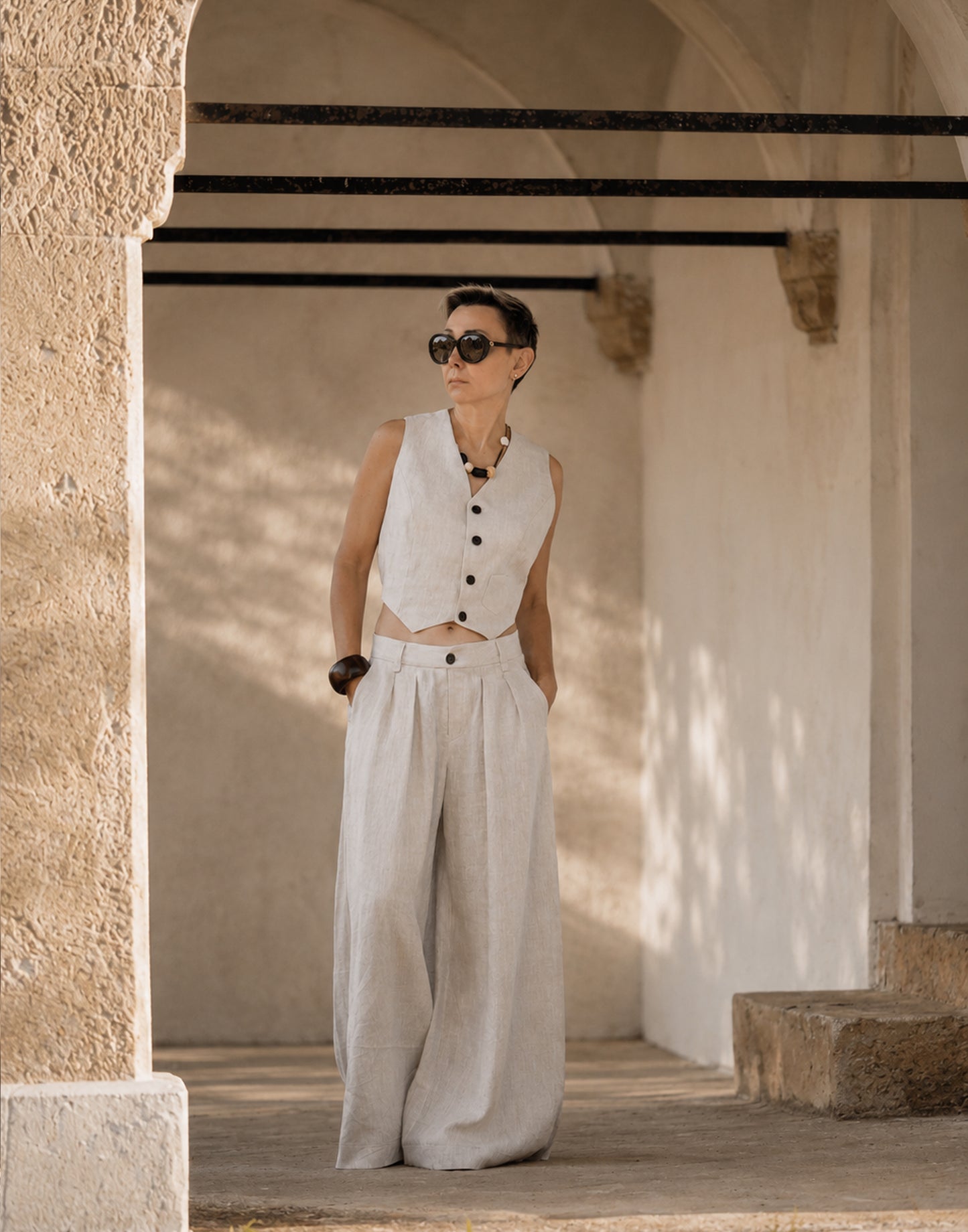 Natural Linen vest styled with wide leg linen trousers in a coordinated outfit