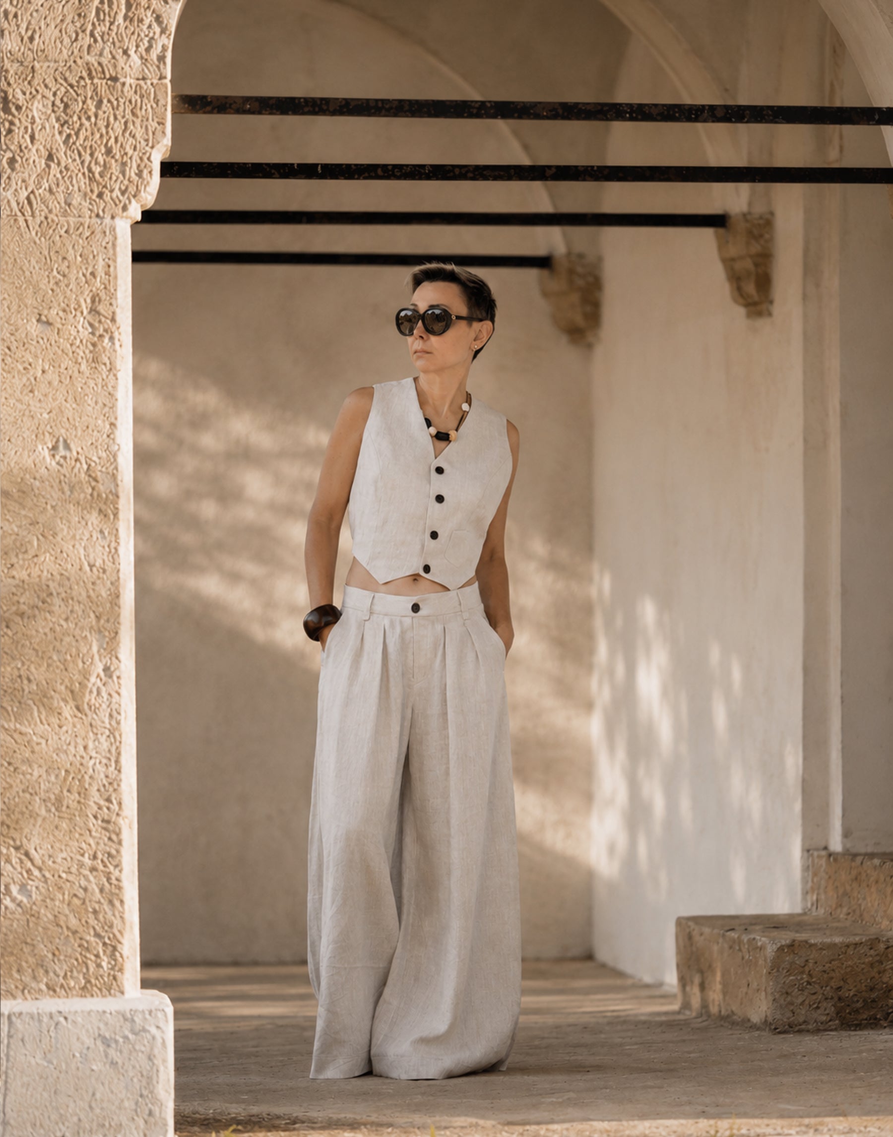 Natural Linen vest styled with wide leg linen trousers in a coordinated outfit