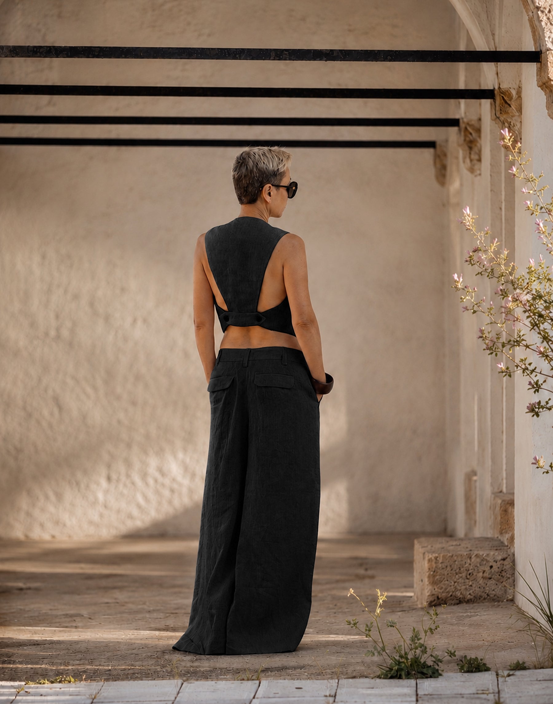Black Olive linen vest with decorative back strap and horn buttons